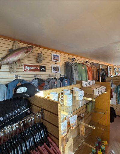 gift shop general store Clothing store with shirts, mugs, and merchandise display.