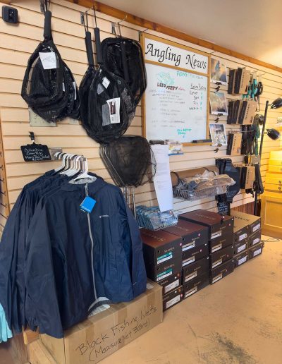 lees ferry gallery 11 Fishing gear and apparel in angling store display.
