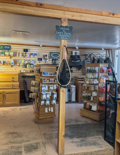 lees ferry gallery 13 Cozy fishing gear shop interior with supplies.