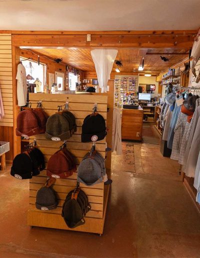 lees ferry gallery 14 Fishing store interior with hats and books display.