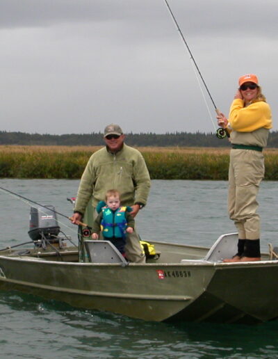 terry wendy and troy gunn Family fishing on a boat in a lake.