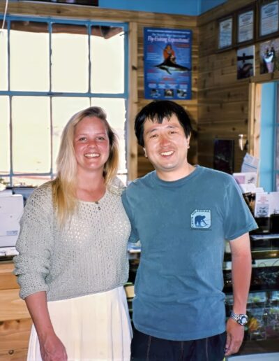 wendy gunn in shop Two people smiling inside a wooden shop.
